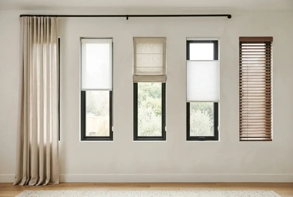 Curtains, roller, Roman, cellular and Venetian window coverings shown side by side